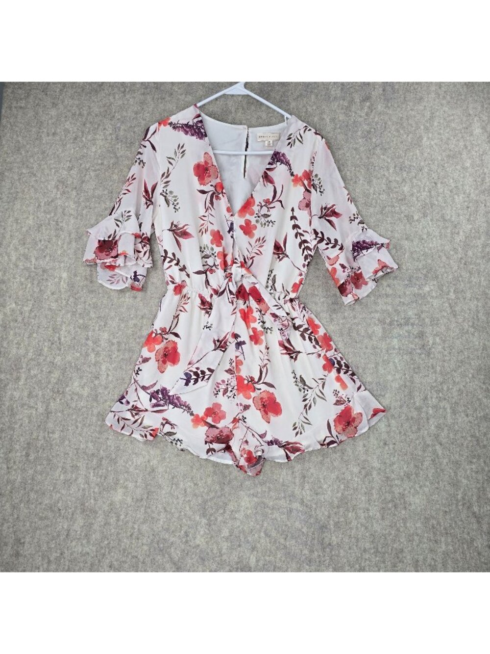 Honey Punch Floral Ruffled Romper With Tie Waist & V-Neck Design